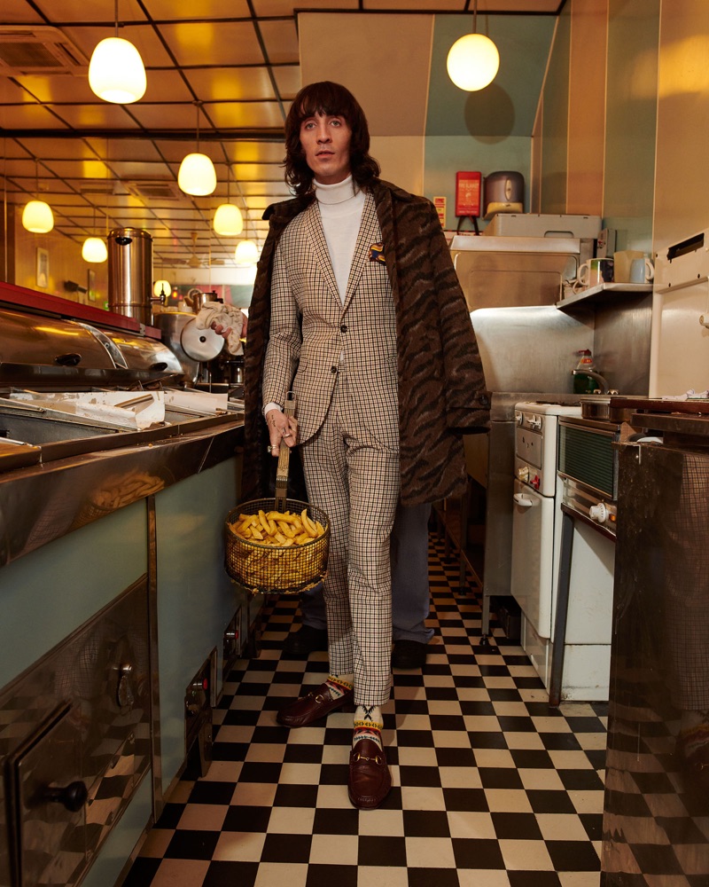 Carrying a basket of fries, Juan Milan stars in Club of Gents' fall-winter 2019 campaign.