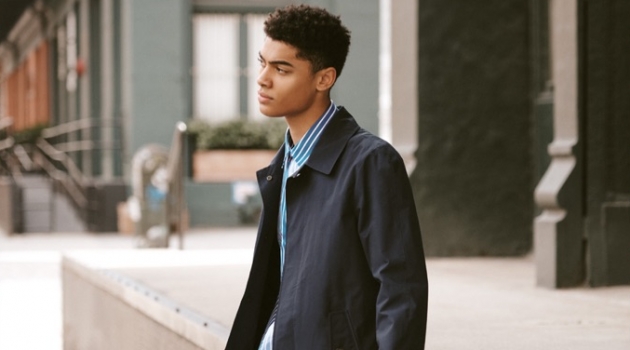 East Dane Proposes 3 Approaches to the Raincoat Model Désiré Mia sports a Baracuta G10 jacket, AMI pants, and a Kenzo short-sleeve shirt.