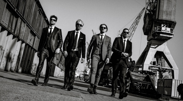 Ric Wersig, Soehnke Twardzik + More in 'On the Waterfront' Left to Right: Julian wears suit Dolce & Gabbana and shirt Seidensticker. Soehnke wears suit The Kooples and shirt BOSS. Ric wears suit Selected Homme and shirt Suitsupply. Chris wears suit Drykorn and shirt Angelo Litrico.