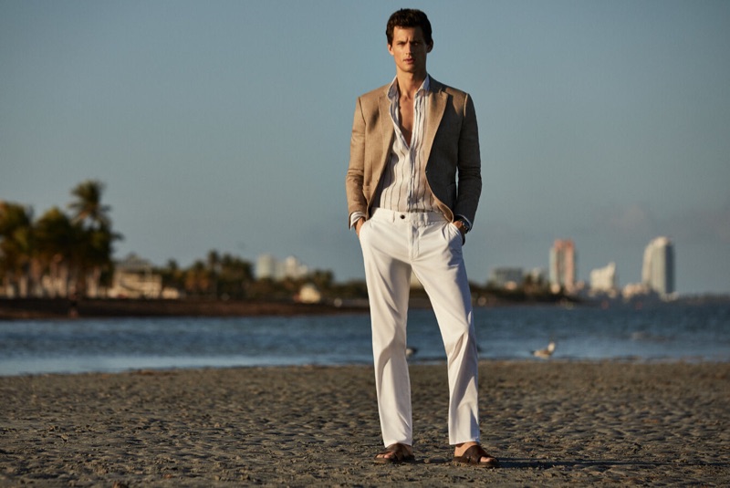 Taking to the beach, Garrett Neff models a chic summer look by Pedro del Hierro.