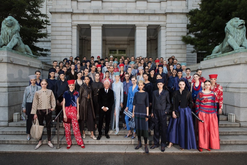 Designer Giorgio Armani poses with the models who walked in his cruise 2020 show.