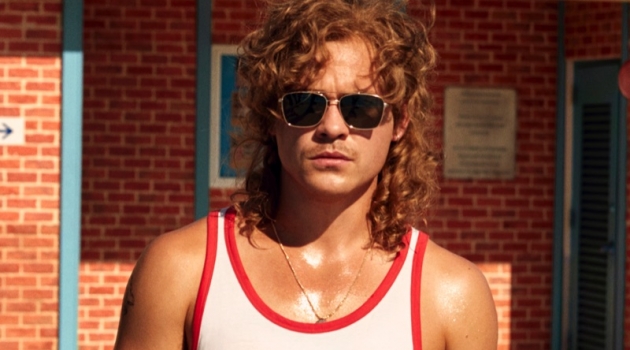 Dacre Montgomery Gears Up for Lifeguard Duty in H&M 'Stranger Things' Campaign Dacre Montgomery wears a tank and red swim shorts from H&M's Stranger Things collaboration.