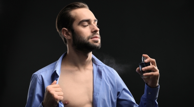 Ever Wanted to Smell Like Your Favorite Casino? Now You Can Handsome Man Open Shirt Spraying Cologne