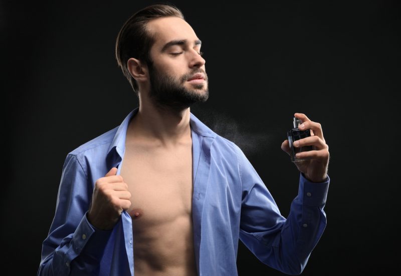 Handsome Man Open Shirt Spraying Cologne Handsome Man Open Shirt Spraying Cologne