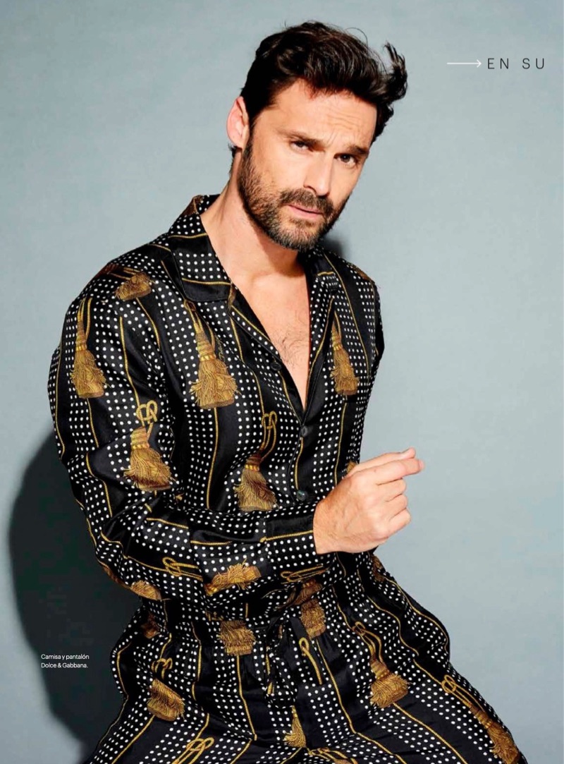 Embracing an all-over print, Iván Sánchez wears a shirt and pants by Dolce & Gabbana.