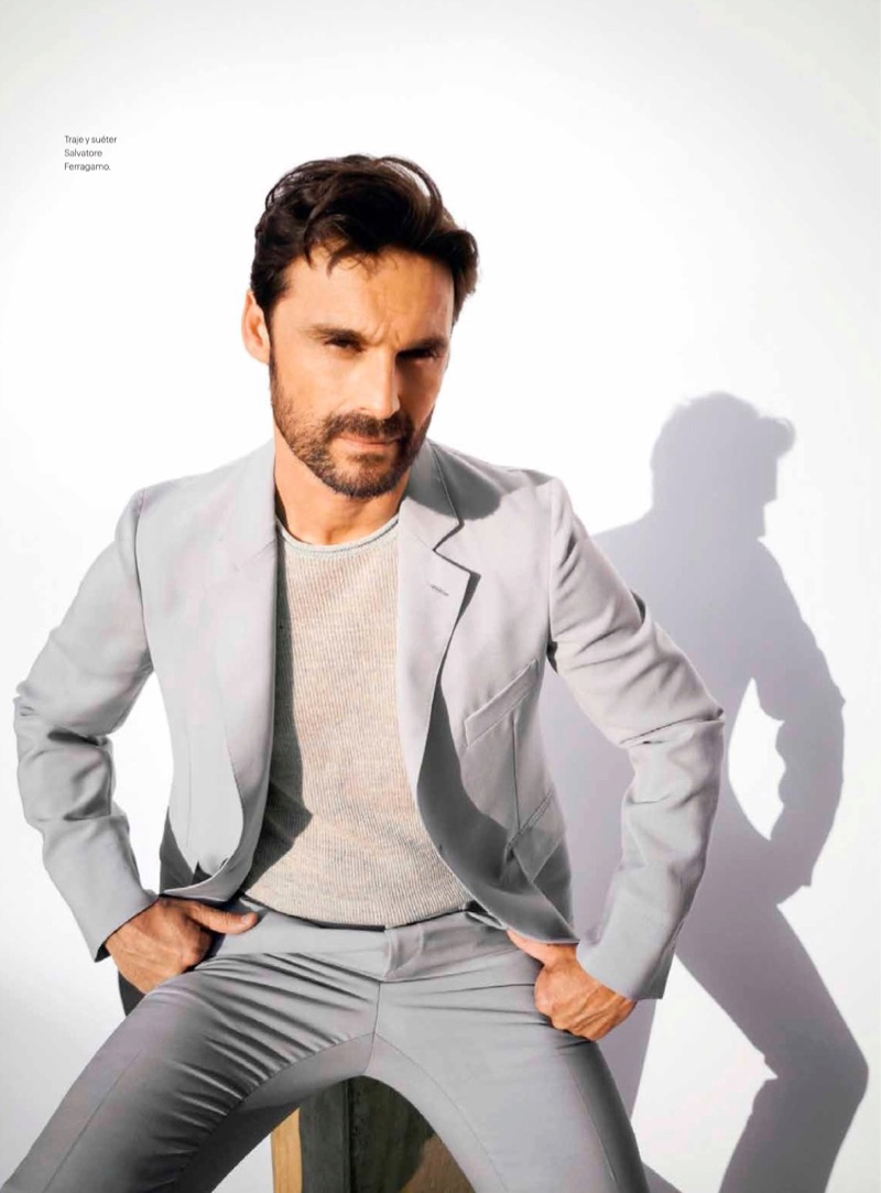 Embracing shades of grey, Iván Sánchez wears a sweater and suit from Salvatore Ferragamo.