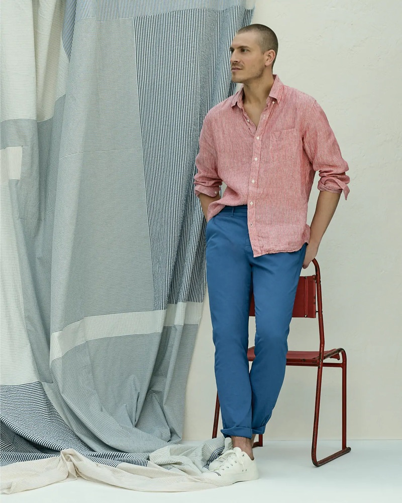 Going casual, Mike Guenther dons a red Baird McNutt Irish linen shirt, J.Crew 770 straight-fit garment-dyed chinos, and Pro-Keds Royal Lo sneakers.