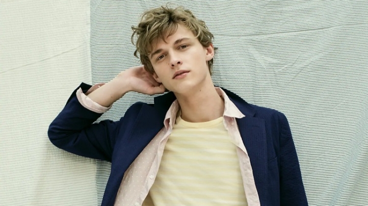 Embracing pastels, Max Barczak wears a J.Crew navy Ludlow slim-fit unstructured blazer and pants in stretch seersucker. He also sports J.Crew's dot print heathered shirt and striped essential crewneck t-shirt.
