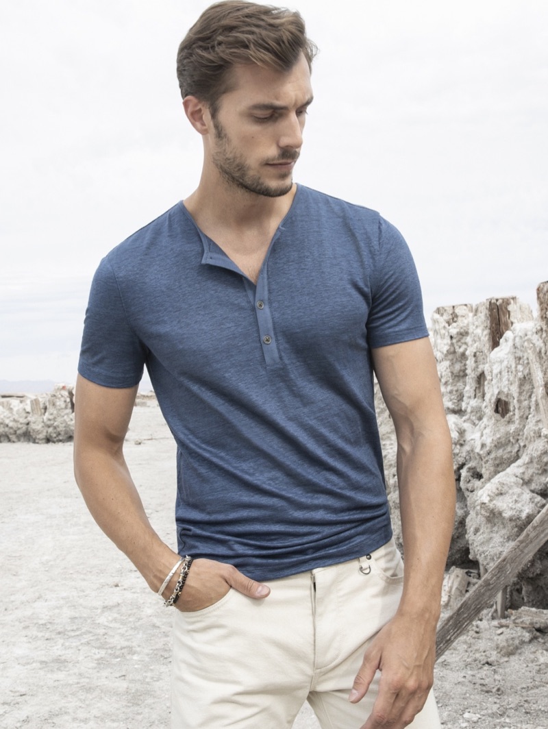 Donning a John Varvatos Collection linen henley $188, Federico Cola showcases casual style.