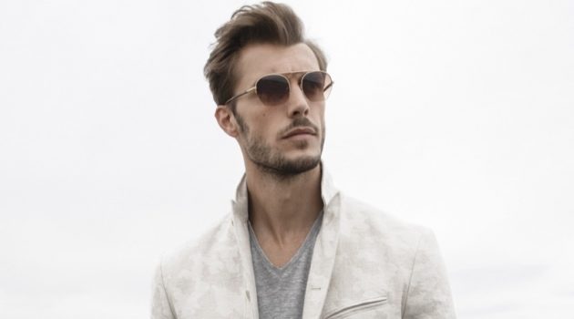 Federico Cola Heads Into Summer with John Varvatos A chic vision, Federico Cola dons a John Varvatos Collection camo jacquard jacket $1,298.