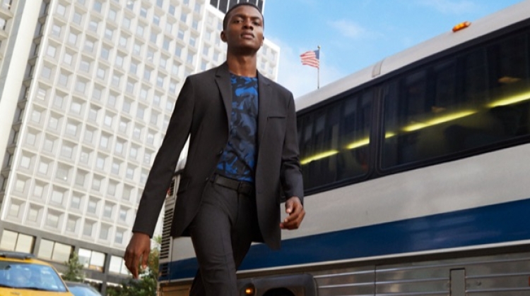Donning a suit, Jubril Oyedeji appears in Kenneth Cole's spring-summer 2019 campaign.