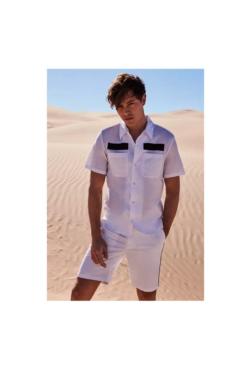 Front and center, Francisco Lachowski sports a Calvin Klein scout shirt $79.50 and flat-front shorts $79.50.