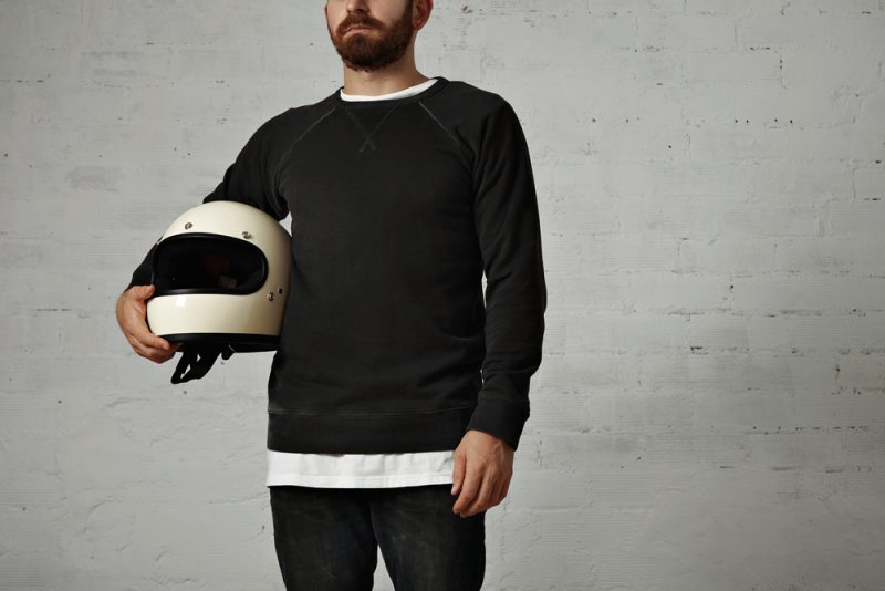 Man Holding Motorcycle Helmut Wearing Sweatshirt