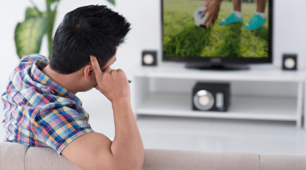 How to Choose the Best TV Stand for Your Living Room Man Watching TV Television Stand