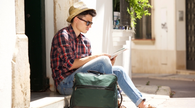 Can You Use Sunglasses While Studying? Man in Hat and Sunglasses Reading