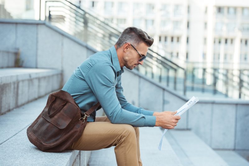 Man in Sunglasses Reading