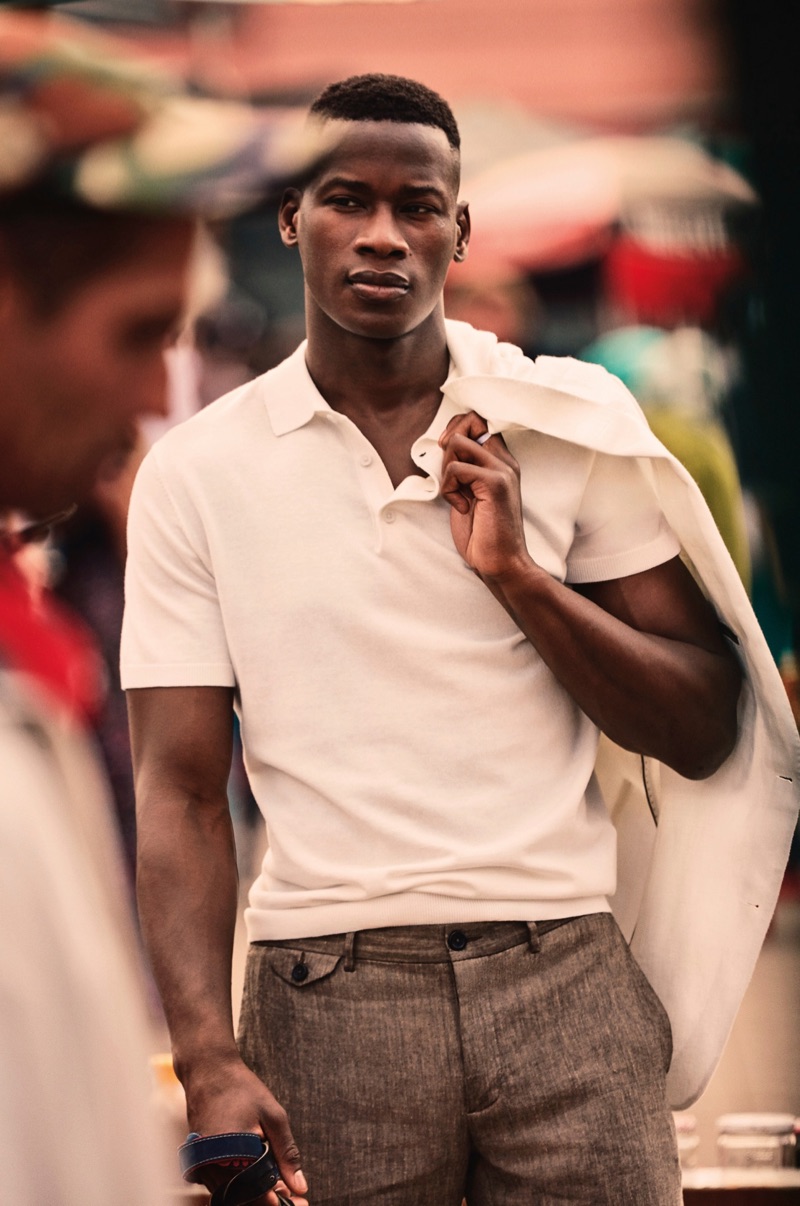 David Agbodji wears a polo and linen pants from Mango.