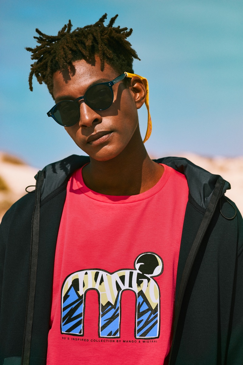 Channeling 90s style, Ty Ogunkoya sports a graphic t-shirt from Mango's Mistral collaboration.