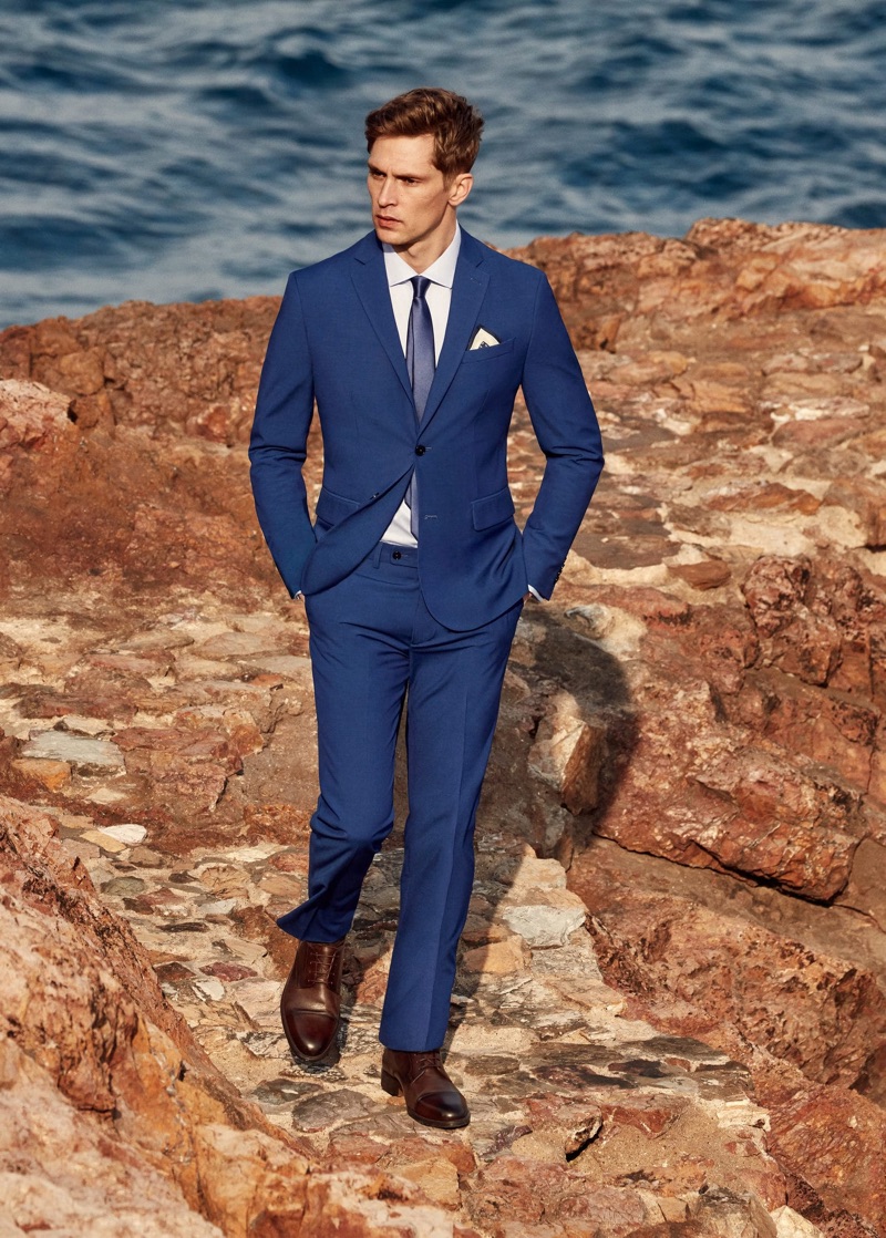 Donning a blue suit, Mathias Lauridsen connects with Mango.