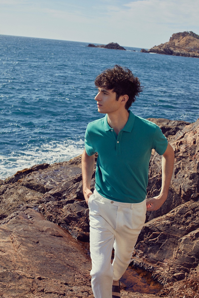 Embracing smart style, Oscar Kindelan dons a polo for Massimo Dutti's summer 2019 campaign.