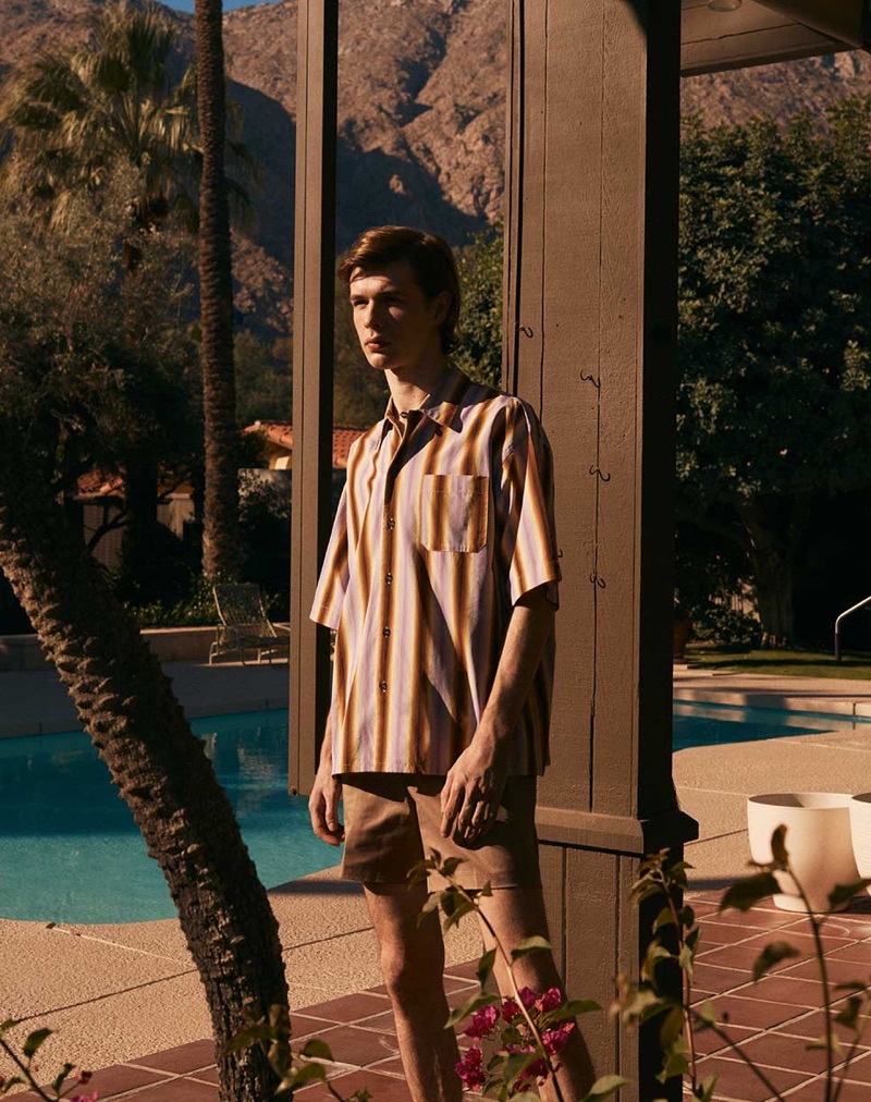 Wearing shades of brown, Efraim Schröder rocks a Marni shirt with Salle Privée shorts.