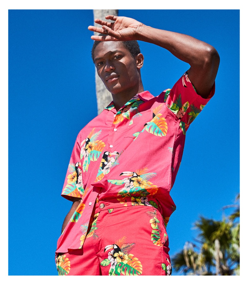 Hamid Onifade wears a red Club Room camp collar graphic shirt $49.50.