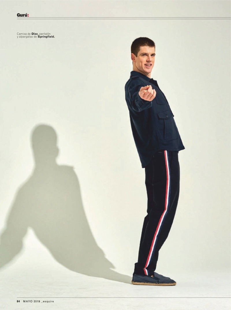 Starring in a new photo shoot, Miguel Bernardeau sports a Dior Men shirt with pants and espadrilles by Springfield.
