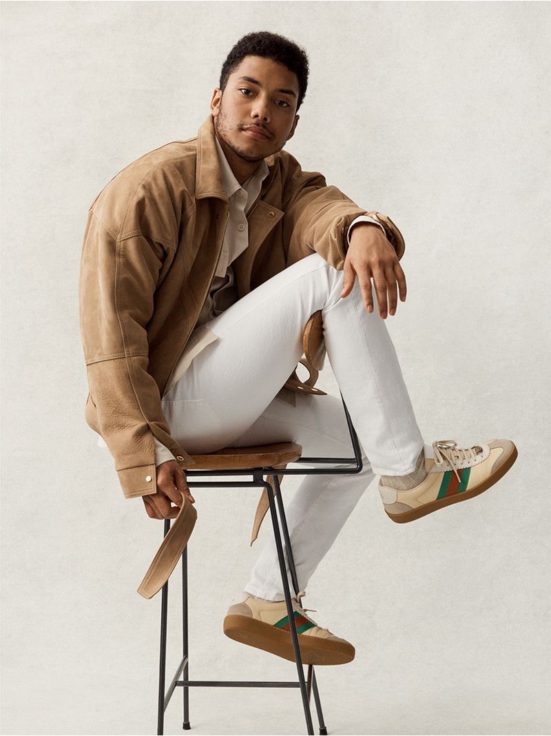 Looking sharp, Chance Perdomo wears a Fear of God jacket, Our Legacy shirt, James Perse t-shirt, POLO Ralph Lauren denim jeans, and Gucci sneakers.