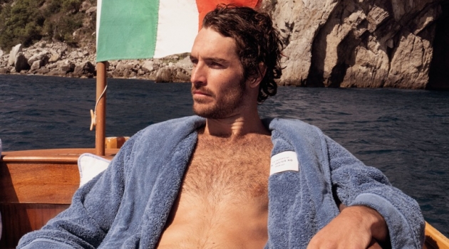 Orlebar Brown Launches Exclusive 007 Collection Lounging, Justice Joslin wears an Orlebar Brown Dr No toweling robe $475.
