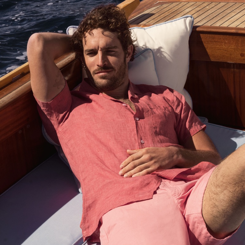 Connecting with Orlebar Brown, Justice Joslin wears the brand's 007 Thunderball shirt $295 with a capri collar.