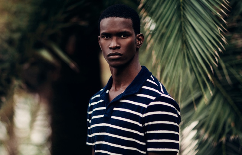 Salomon Diaz dons a striped polo shirt by Orlebar Brown.