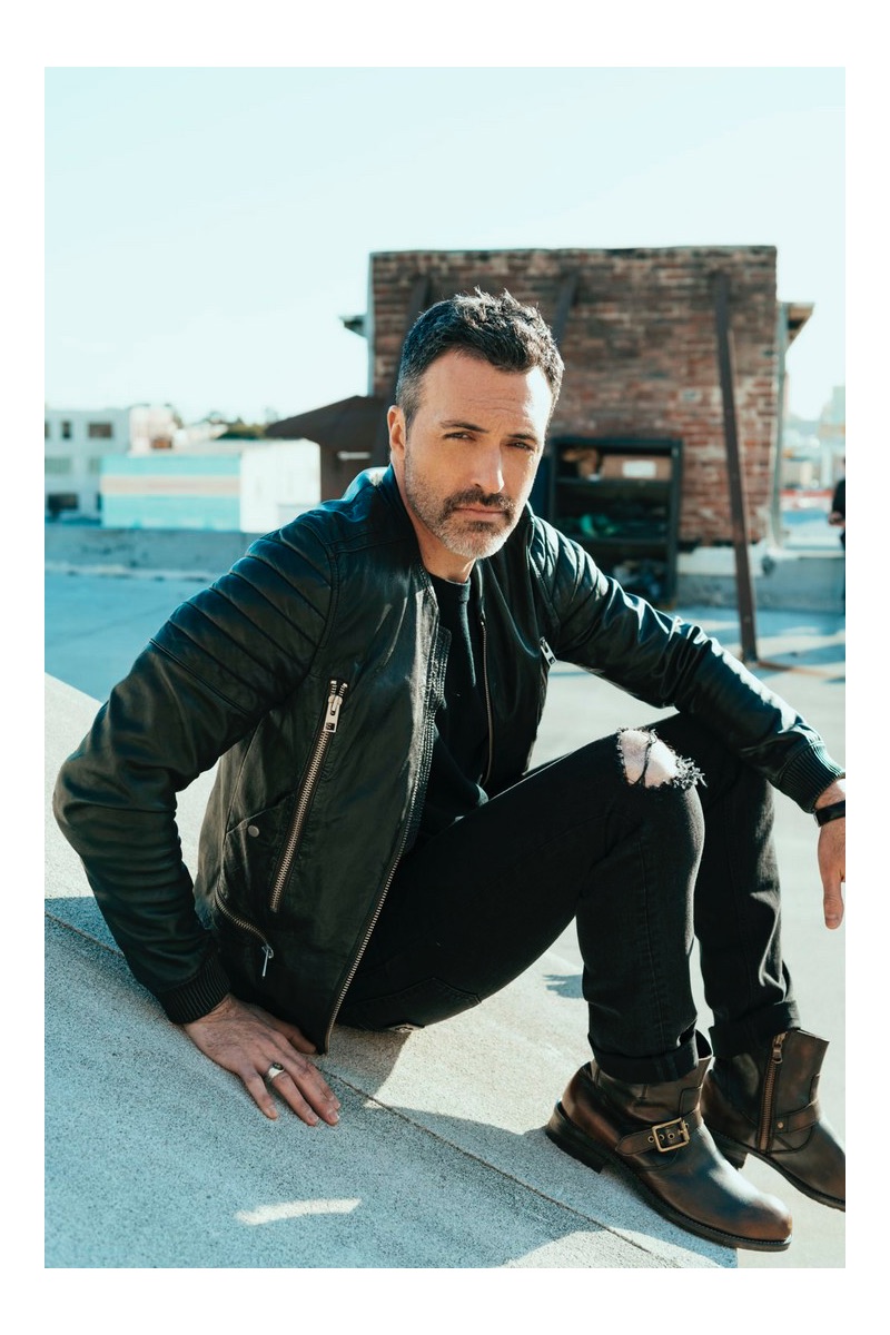 Actor Reid Scott dons an AllSaints leather jacket with Dolce & Gabbana jeans and his own boots.