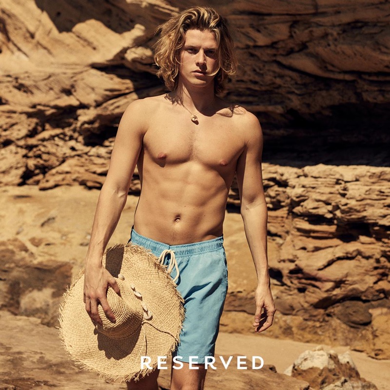 Biel Juste wears swim shorts from Reserved's summer 2019 collection.