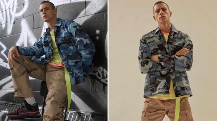 Mixing camouflage prints, Augusta Alexander sports a ROTHCO blue tactical camo shirt and camouflage cargo pants with a neon DJAB t-shirt. He completes his look with a yellow Outcome belt.