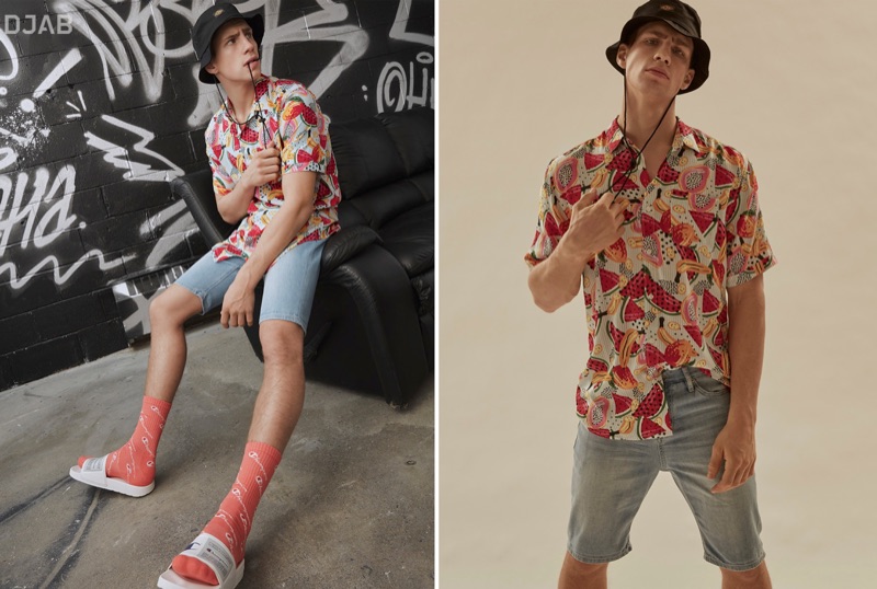 Reuniting with Simons, Augusta Alexander rocks a DJAB patterned shirt and denim shorts with Champion Jock slides and logo ribbed socks.