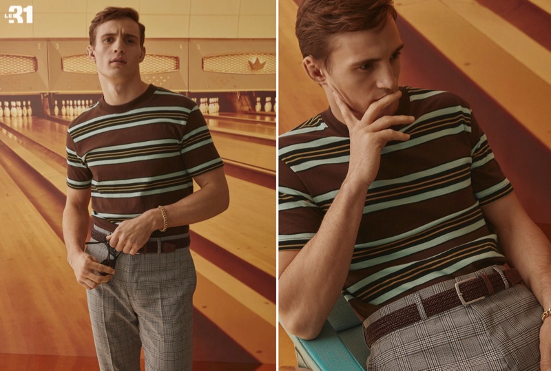 Front and center, Julian Schneyder dons a LE 31 retro striped t-shirt, braided leather belt, and gingham suit pants.