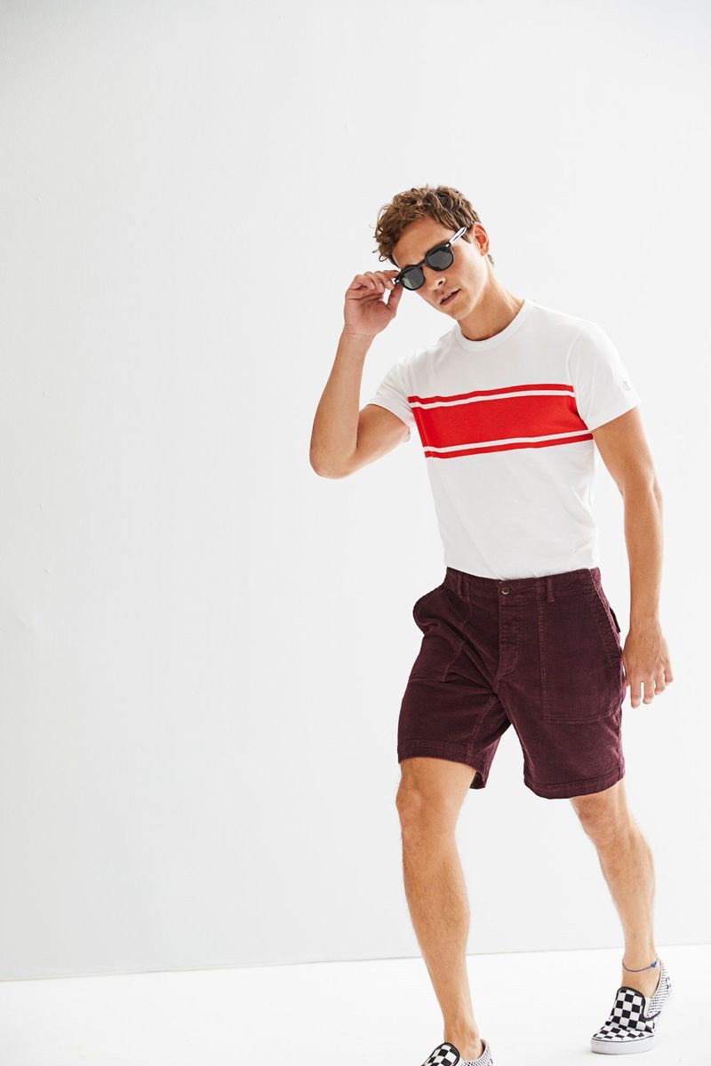 Alexandre Cunha sports a Todd Snyder + Champion chest stripe tee $70 with 9" stretch Italian corduroy camp shorts $168 in burgundy.