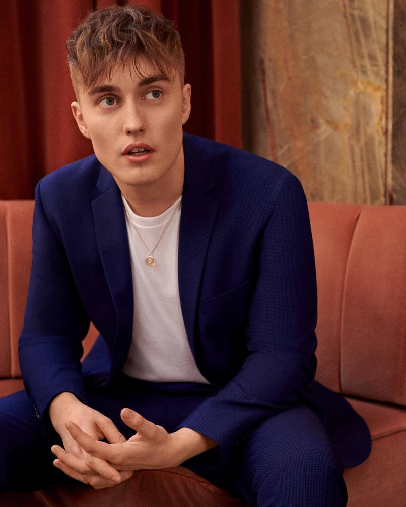 Sam Fender dons a blue suit and white pullover for Topman's latest campaign.