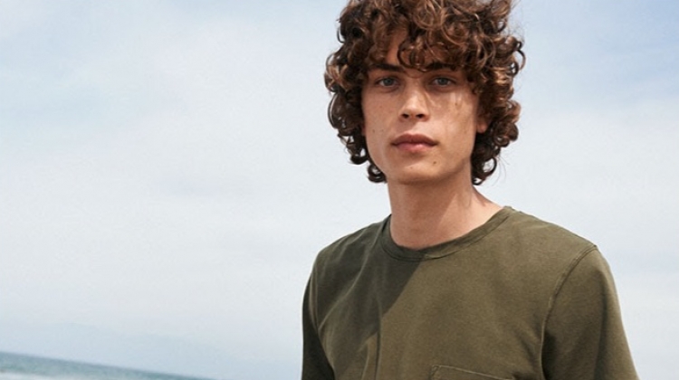 Hitting the beach, Lucas Bin sports military green Dries Van Noten swim shorts $244.