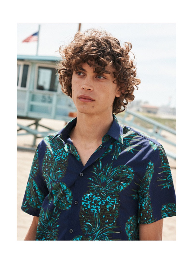 Making a case for leisure, Lucas Bin wears a patterned shirt $540 by Prada.