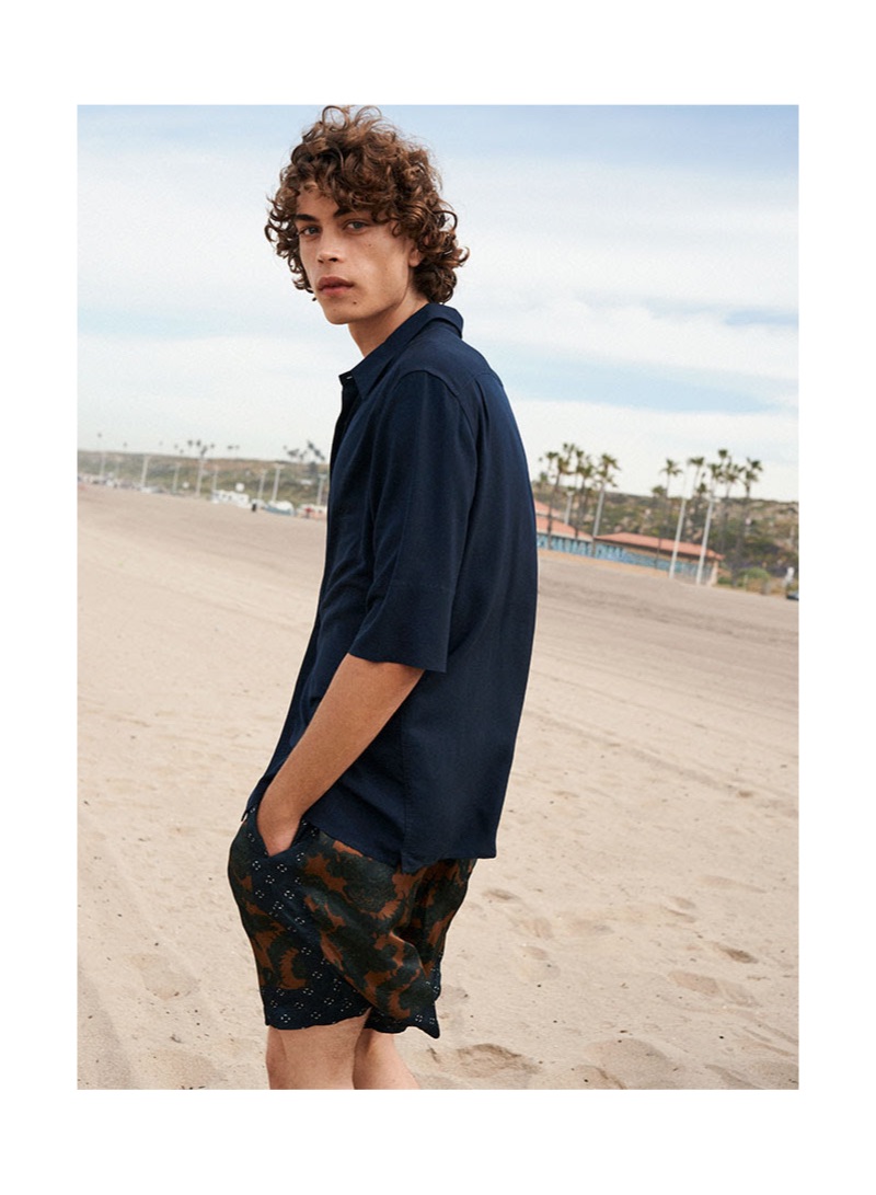 Connecting with YOOX, Lucas Bin hits the beach in summer style.