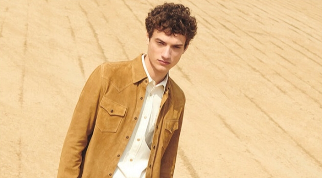 Serge Rigvava Goes Western in YOOX's Cowboy-Inspired Fashions Serge Rigvava embraces western style in a suede overshirt with a Calvin Klein shirt, Gucci jeans, and suede ankle boots.