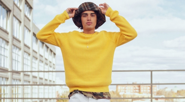 Naleye Dolmans, Dylan Fender + More Join Zara's Stylish Tribe Naleye Dolmans sports a yellow ribbed sweater with a camouflage t-shirt, plaid bucket hat, and pants from Zara.