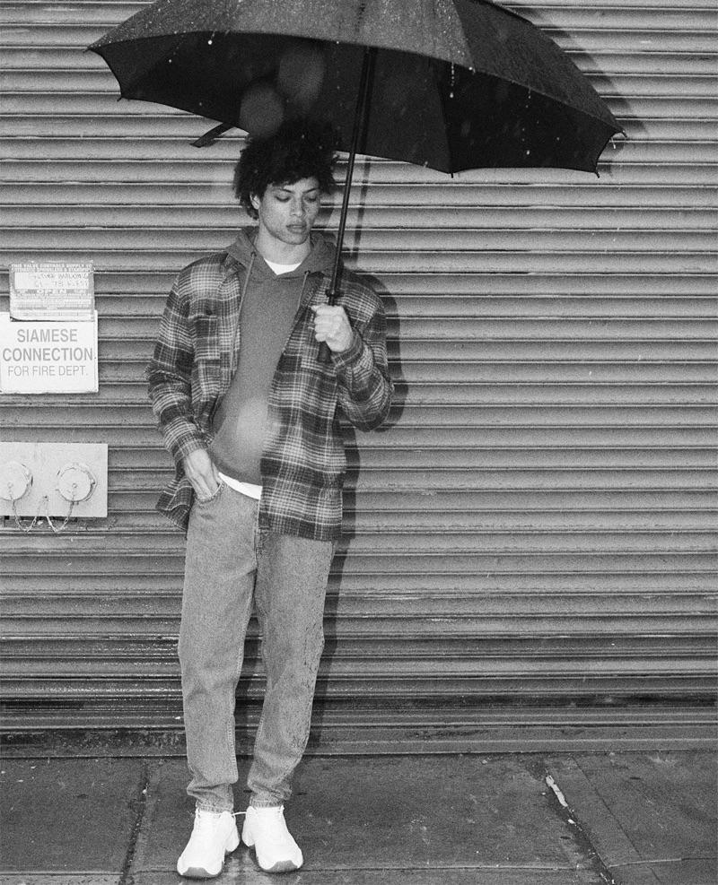 Enduring a rainy day, Danny McFadden wears a look from Zara.