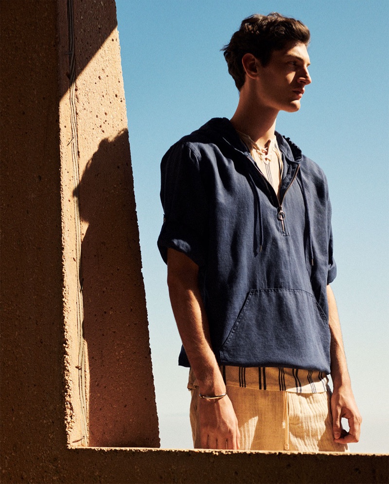 Venturing outdoors, Aaron Shandel sports linen fashions from Zara.