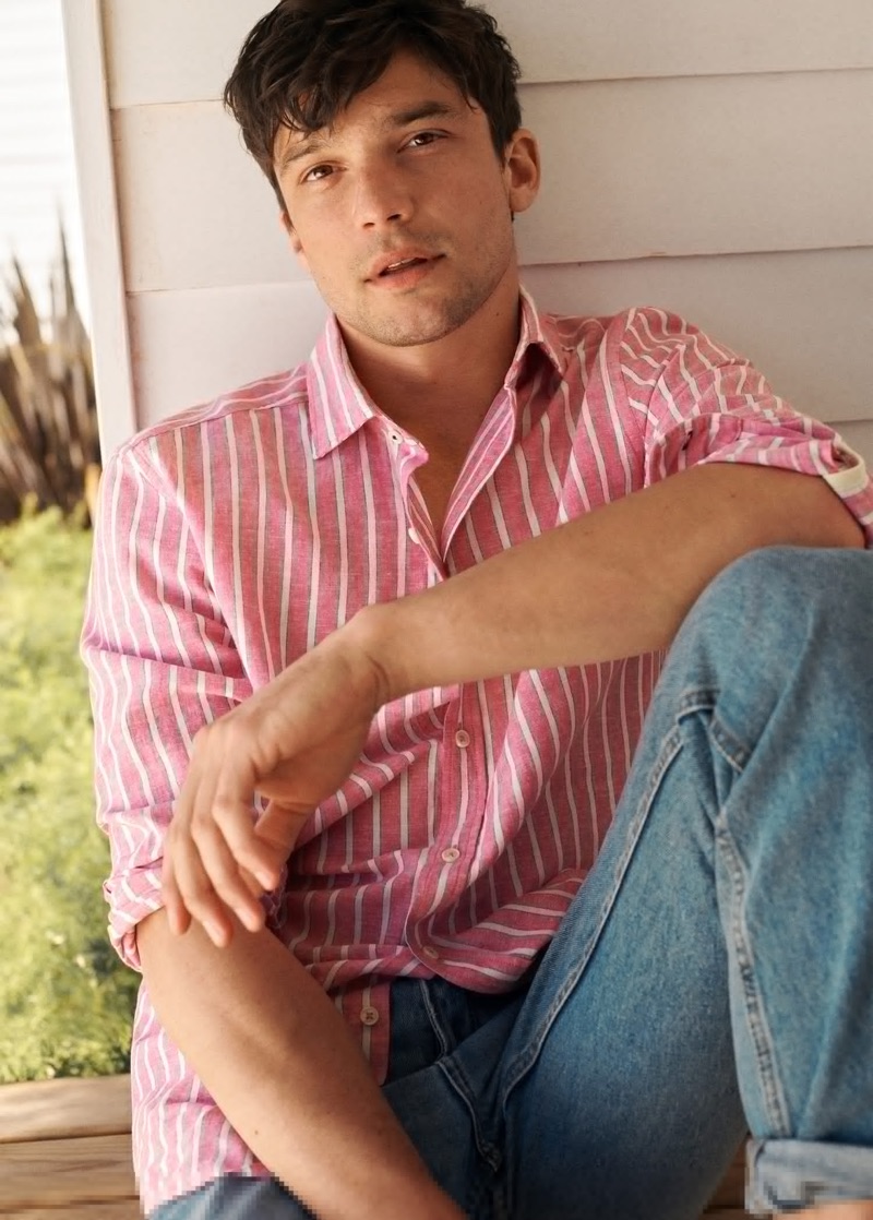 A summer vision, Alexis Petit wears a striped pink shirt with jeans from Mango.