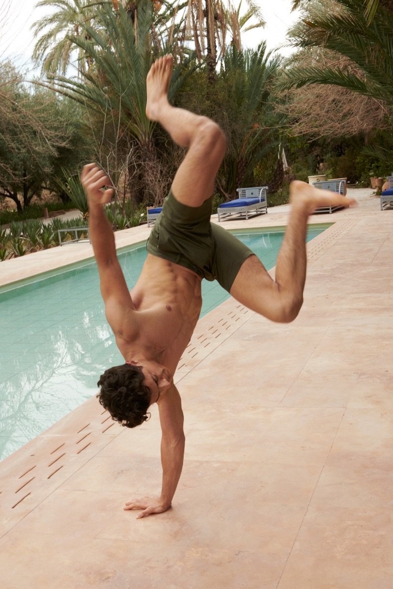 Enjoying a day poolside, Cyrus Amini rocks Banana Republic's 9" slim stretch-cotton shorts.