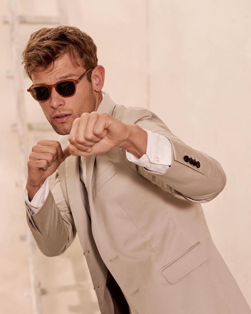 Model Elliott Reeder sports Banana Republic's sunglasses $98 and a slim Core Temp blazer $249.