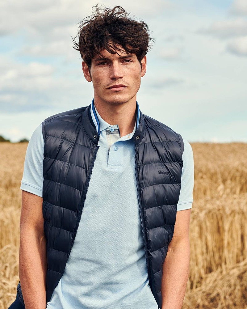 British model Sam Way dons a quilted vest and shirt from the fall-winter 2019 Barbour Tartan collection.