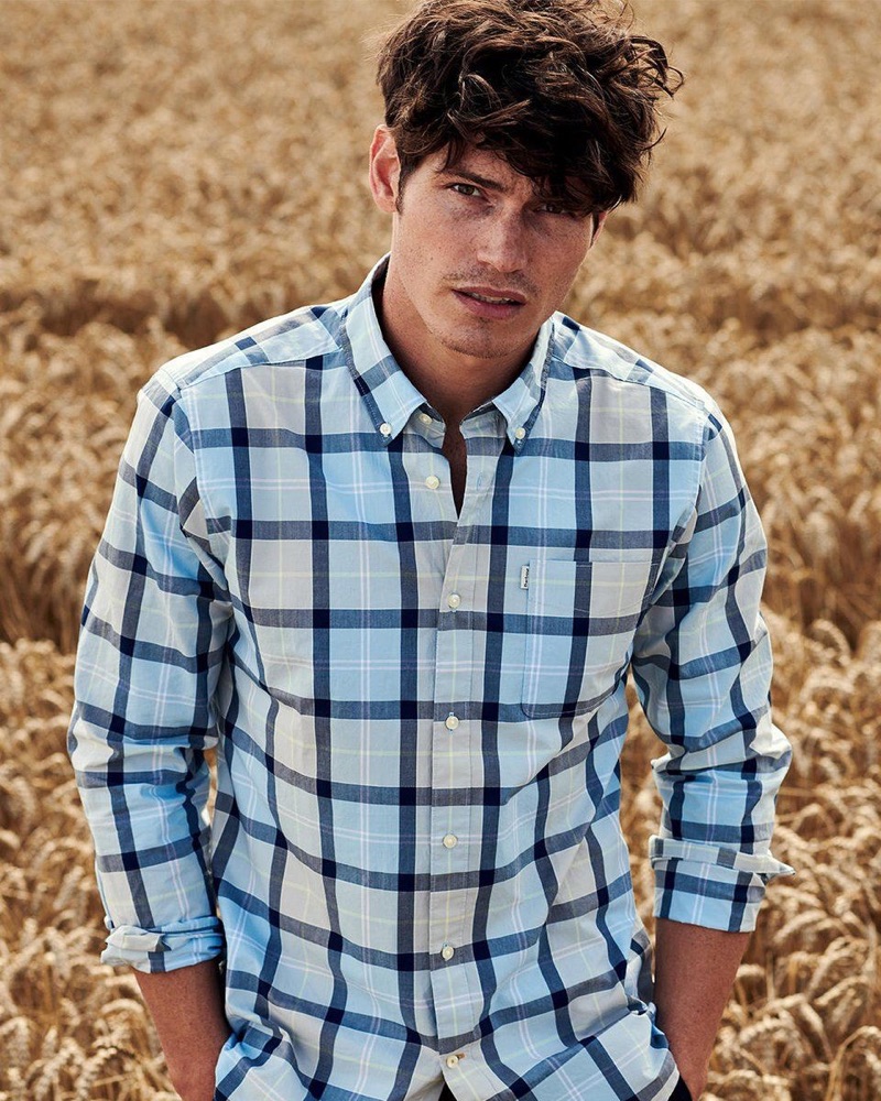 Venturing outdoors, Sam Way wears a checked shirt from the Barbour Tartan fall-winter 2019 collection.